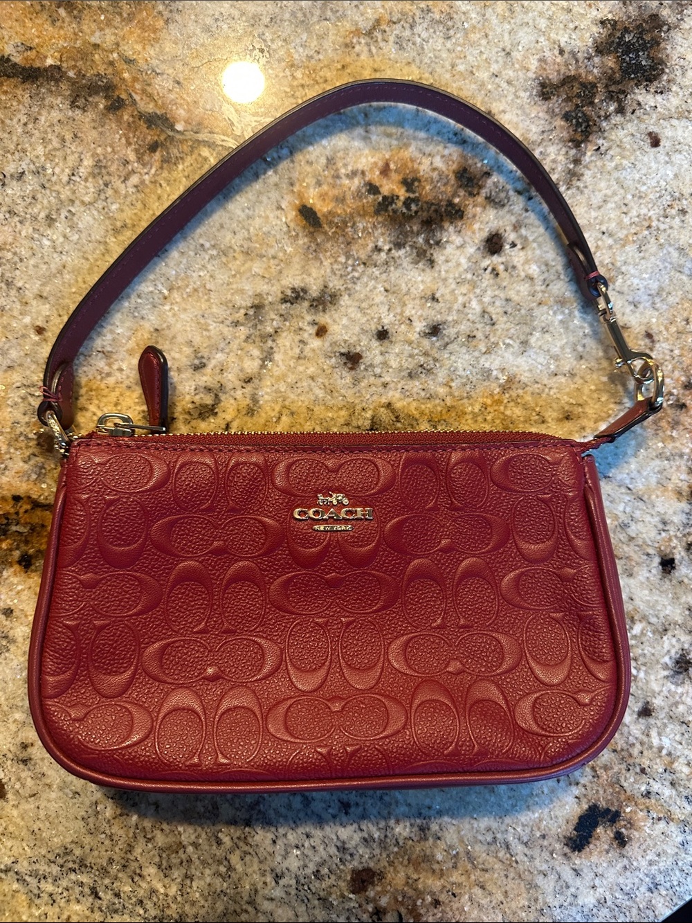 Coach Burgundy Embossed Signature Leather Wristlet